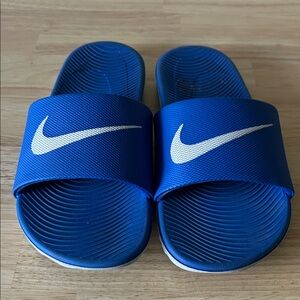 Nike Youth Sludes. Blue wit white swoosh. Size 6Y.